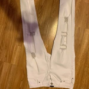 Distressed white jeans